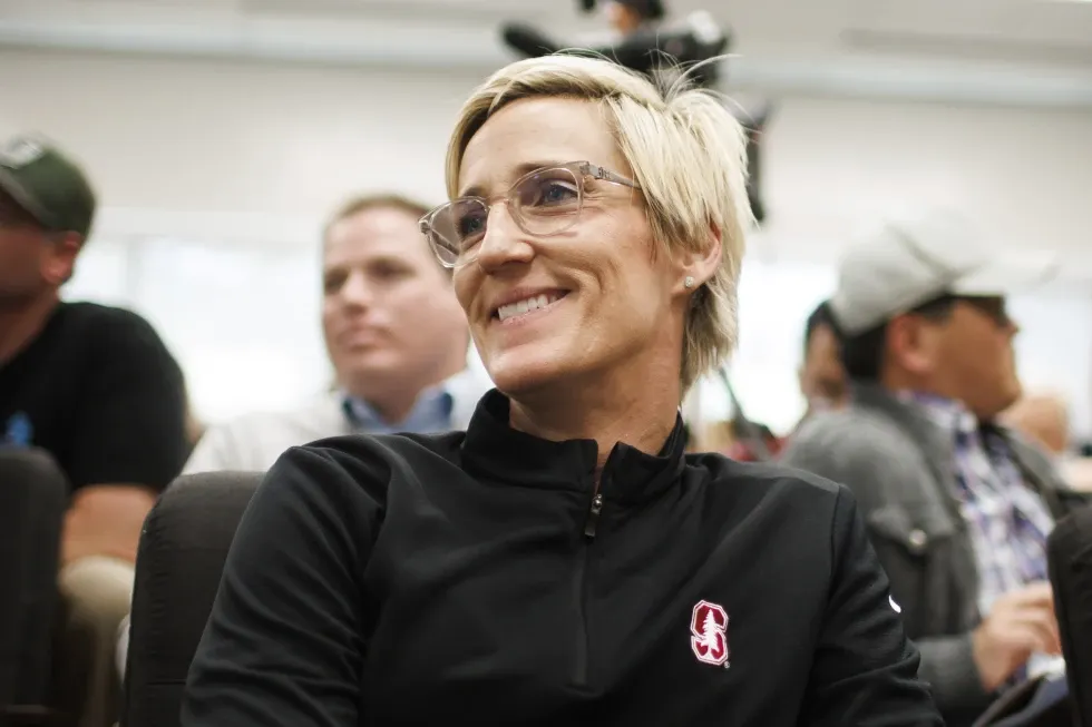 Stanford associate head coach Kate Paye listens to VanDerveer during a news conference in Stanford, Calif., Wednesday, April 10, 2024. VanDerveer, the winningest basketball coach in NCAA history, announced her retirement Tuesday night after 38 seasons leading the Stanford women’s team and 45 years overall.