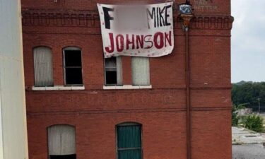 Shreveport's Democratic Socialists of America (DSA) group targeted Speaker of the House Mike Johnson with a sign with profane language on May 22.