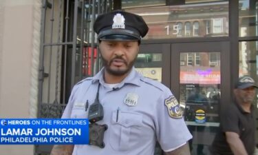 A Philadelphia police officer didn't miss a beat when a man flagged him down to help his wife who wasn't breathing. On a busy West Philadelphia intersection