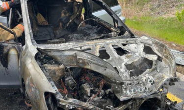 The aftermath of the car fire that started as Maggie Marchand was driving on Route 101.