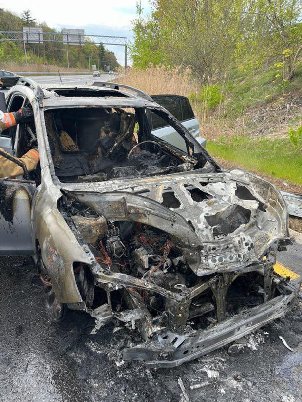 <i>WBZ via CNN Newsource</i><br/>The aftermath of the car fire that started as Maggie Marchand was driving on Route 101.