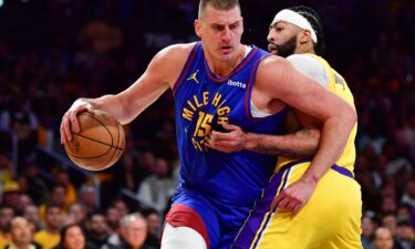 Denver Nuggets center Nikola Jokic moves the ball against Los Angeles Lakers forward Anthony Davis.