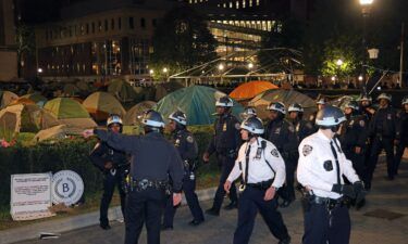 NYPD officers in riot gear enter Columbia University's encampment as they evict a building that had been barricaded by pro-Palestinian protesters in New York City on April 30