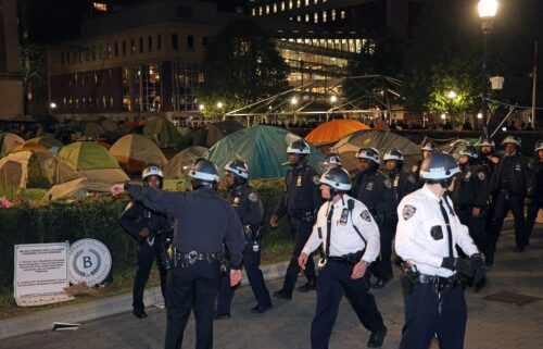 NYPD officers in riot gear enter Columbia University's encampment as they evict a building that had been barricaded by pro-Palestinian protesters in New York City on April 30