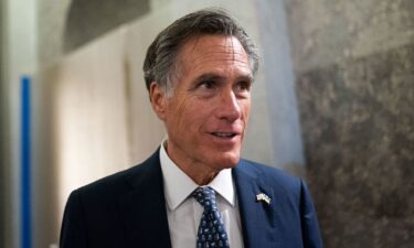 U.S. Senator Mitt Romney speaks with members of the media ahead of a Senate vote to begin work on a bill that includes aid for Ukraine