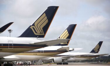 Emergency personnel are seen at a Bangkok airport following a Singapore Airlines plane making an emergency landing due to turbulence.