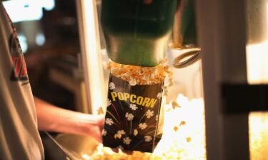 A child buys popcorn at a movie concession stand in Texas in June 1949.