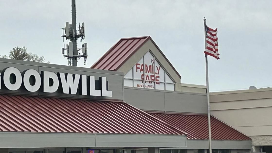 <i>WJRT via CNN Newsource</i><br/>Police removed a woman from the covered sign atop the Family Fare supermarket in Midland.