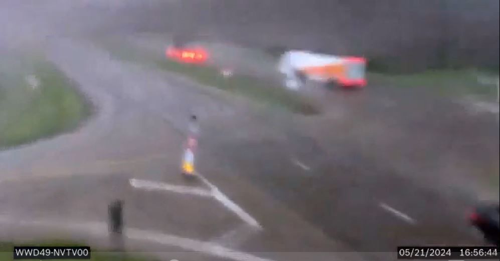 <i>KCCI via CNN Newsource</i><br/>Traffic camera video shows an apparent tornado topple a semi-truck along an Iowa highway.