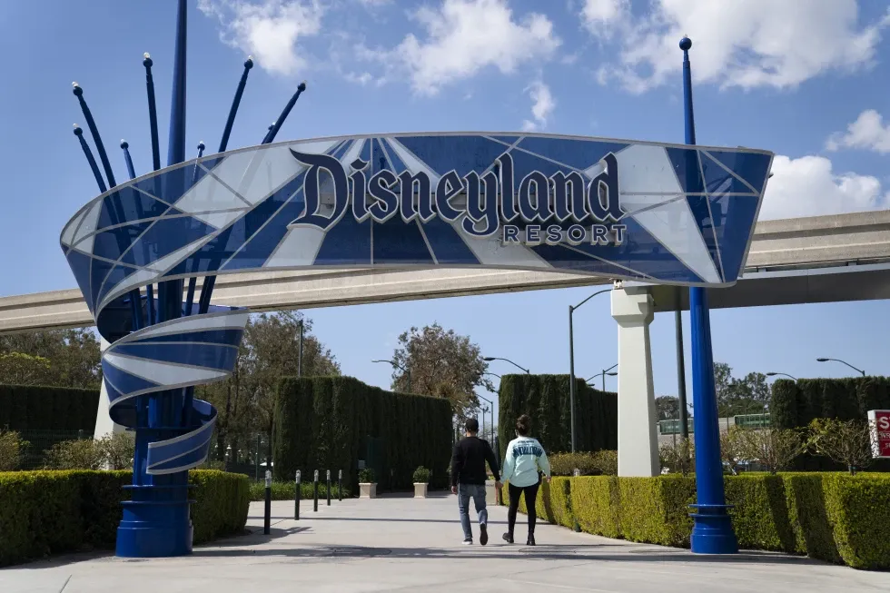 The Disneyland Resort entrance is seen, March 9, 2021, in Anaheim, Calif. A Disneyland employee died Friday, June 7, 2024, after she fell from a moving golf cart in the backstage area of the Southern California theme park, authorities said Saturday, June 9.