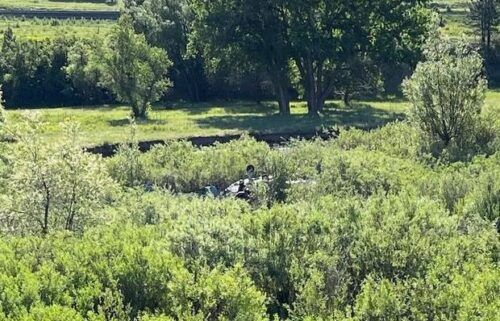 Two people aboard a small plane were injured Sunday morning when their aircraft made an emergency landing near Interstate 25.