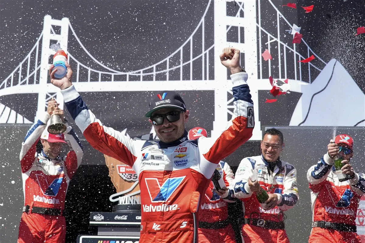 Kyle Larson, center, celebrates after winning a NASCAR Cup Series auto race at Sonoma Raceway