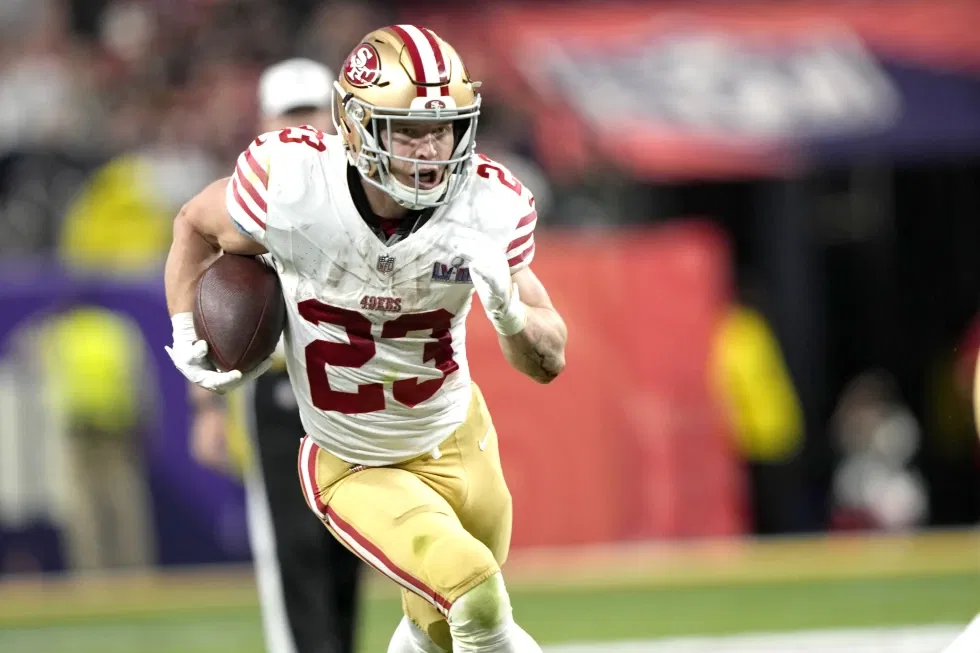 San Francisco 49ers running back Christian McCaffrey scores a touchdown against the Kansas City Chiefs in NFL Super Bowl 58 football game, Feb. 11, 2024, in Las Vegas. The 49ers rewarded McCaffrey with a contract extension after he won the AP Offensive Player of the Year award in his first full season with the team.