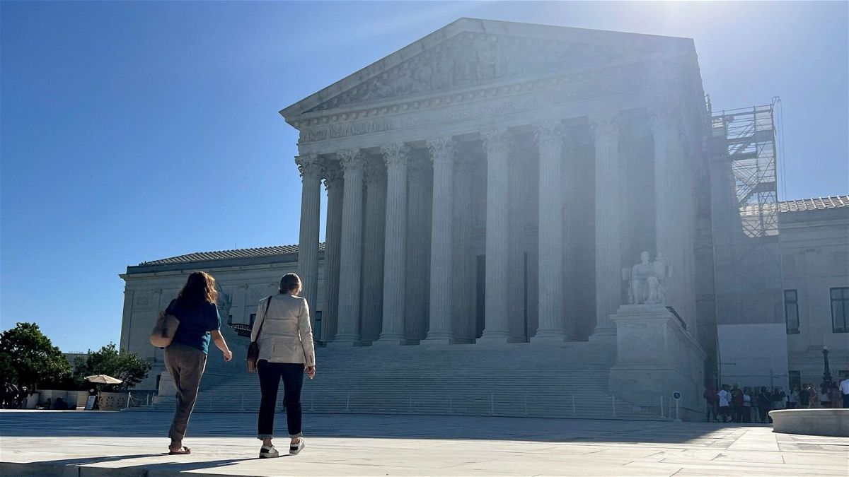 <i>Chip Somodevilla/Getty Images via CNN Newsource</i><br/>Visitors walk across the west plaza of the US Supreme Court on June 7