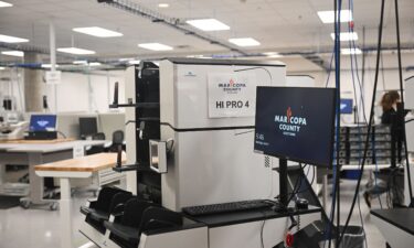 Machines for counting early ballot stand secured in the tabulation room at the Maricopa County Tabulation and Election Center in Phoenix on June 3.