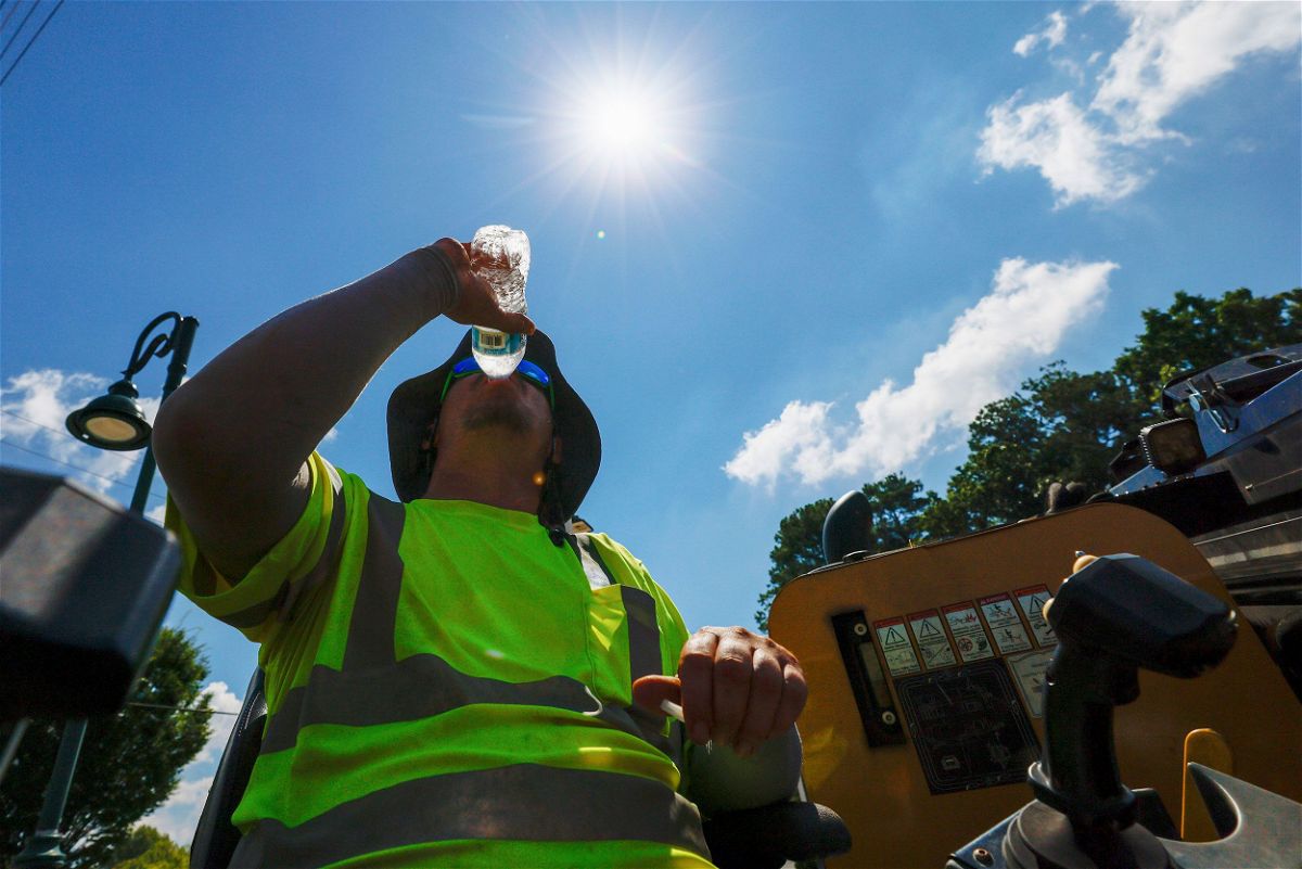 <i>Miguel Martinez/Atlanta Journal-Constitution/AP via CNN Newsource</i><br/>A construction worker drinks water as temperatures soar in Atlanta on June 24.
