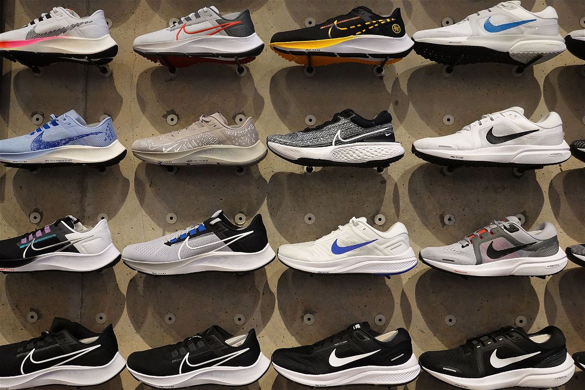 <i>Joe Raedle/Getty Images via CNN Newsource</i><br/>Shoes line the shelves at the Nike store in December 2021 in Miami Beach