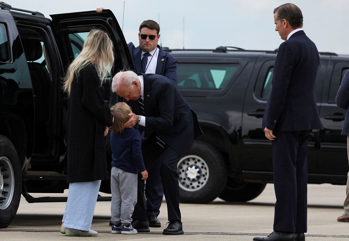 <i>Anna Rose Layden/Reuters via CNN Newsource</i><br/>President Joe Biden embraces his grandson Beau Biden as his daughter-in-law