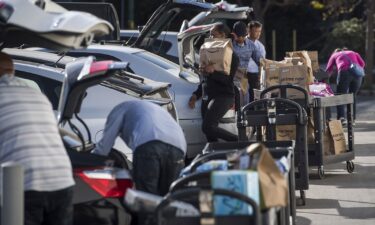 Contractors working for the Amazon Inc. Flex program load packages into vehicles to deliver to customers in San Francisco