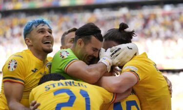 Romania's players celebrate during their victory against Ukraine on June 17.