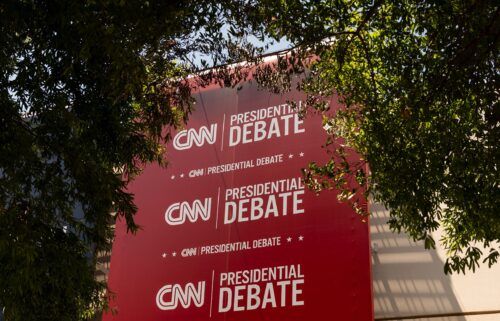 Banners hang outside of CNN’s Atlanta headquarters ahead of CNN’s Presidential Debate between President Joe Biden and former President Donald Trump on June 24.