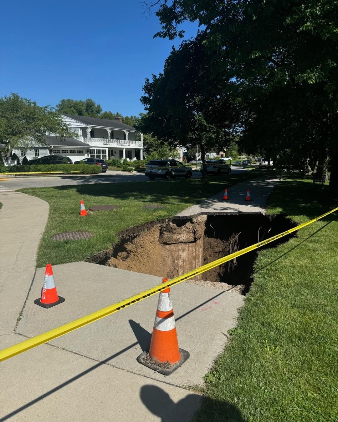 <i>Whitefish Bay Police Department/ WDJT via CNN Newsource</i><br/>A burst stormwater pipe caused a sinkhole in Whitefish Bay.