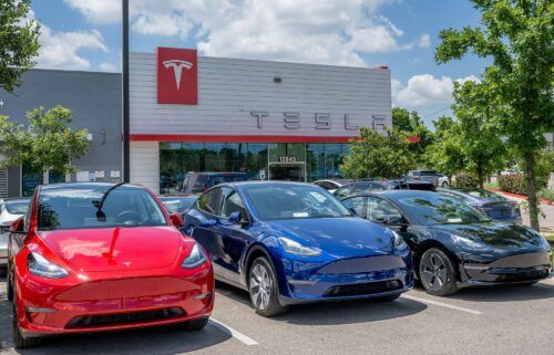 Tesla Model Y vehicles sit on the lot for sale at a Tesla store in Austin
