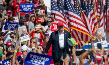 Former President Donald Trump walks onstage at a campaign rally in Chesapeake