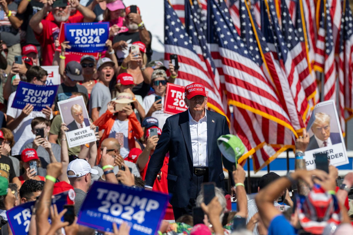 <i>Jim Watson/AFP/Getty Images via CNN Newsource</i><br/>Former President Donald Trump walks onstage at a campaign rally in Chesapeake