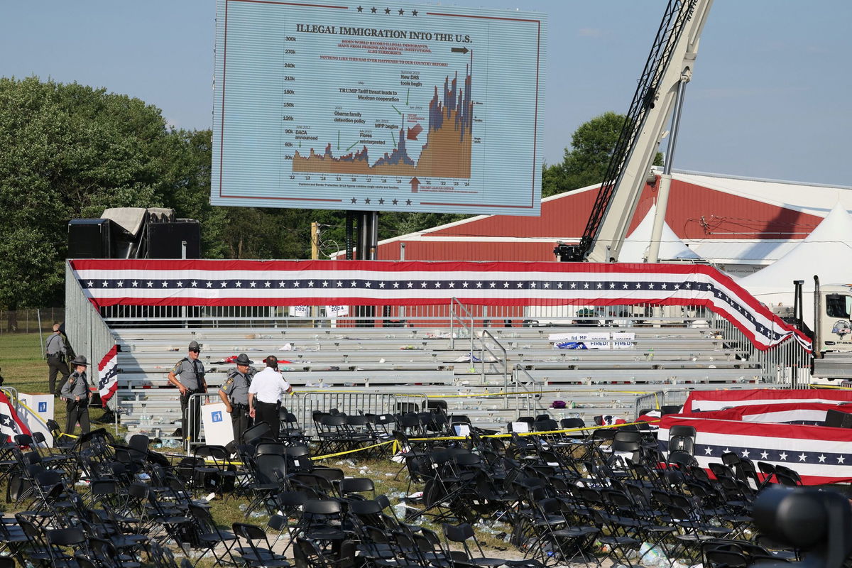 <i>Brendan McDermid/Reuters via CNN Newsource</i><br/>Security personnel inspect the scene in Butler