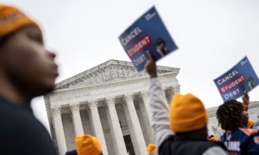 Activists and students protest in front of the Supreme Court during a rally for student debt cancellation in Washington