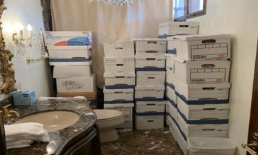 This photo from the US Justice Department shows boxes of classified documents stored in a bathroom and shower in the Mar-a-Lago Club.