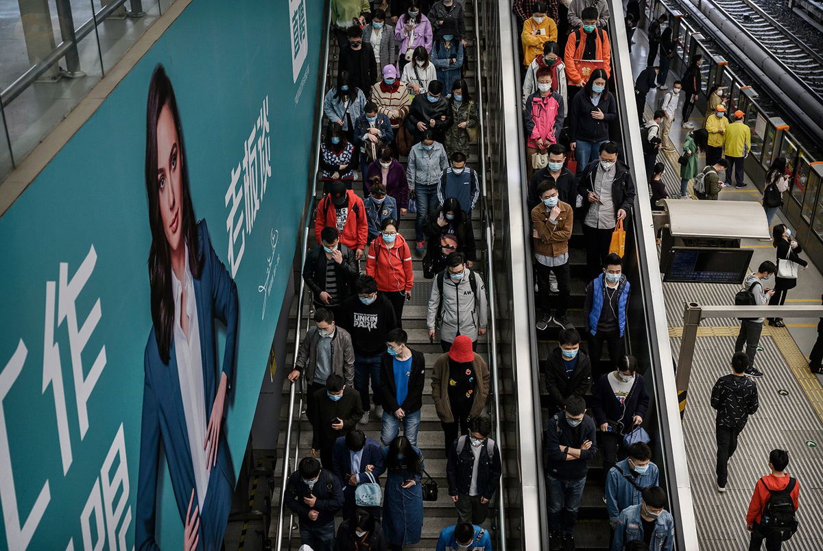 <i>Kevin Frayer/Getty Images via CNN Newsource</i><br/>Xiaotu paid for a personal advertisement on a electronic billboard at a local subway to find his soulmate