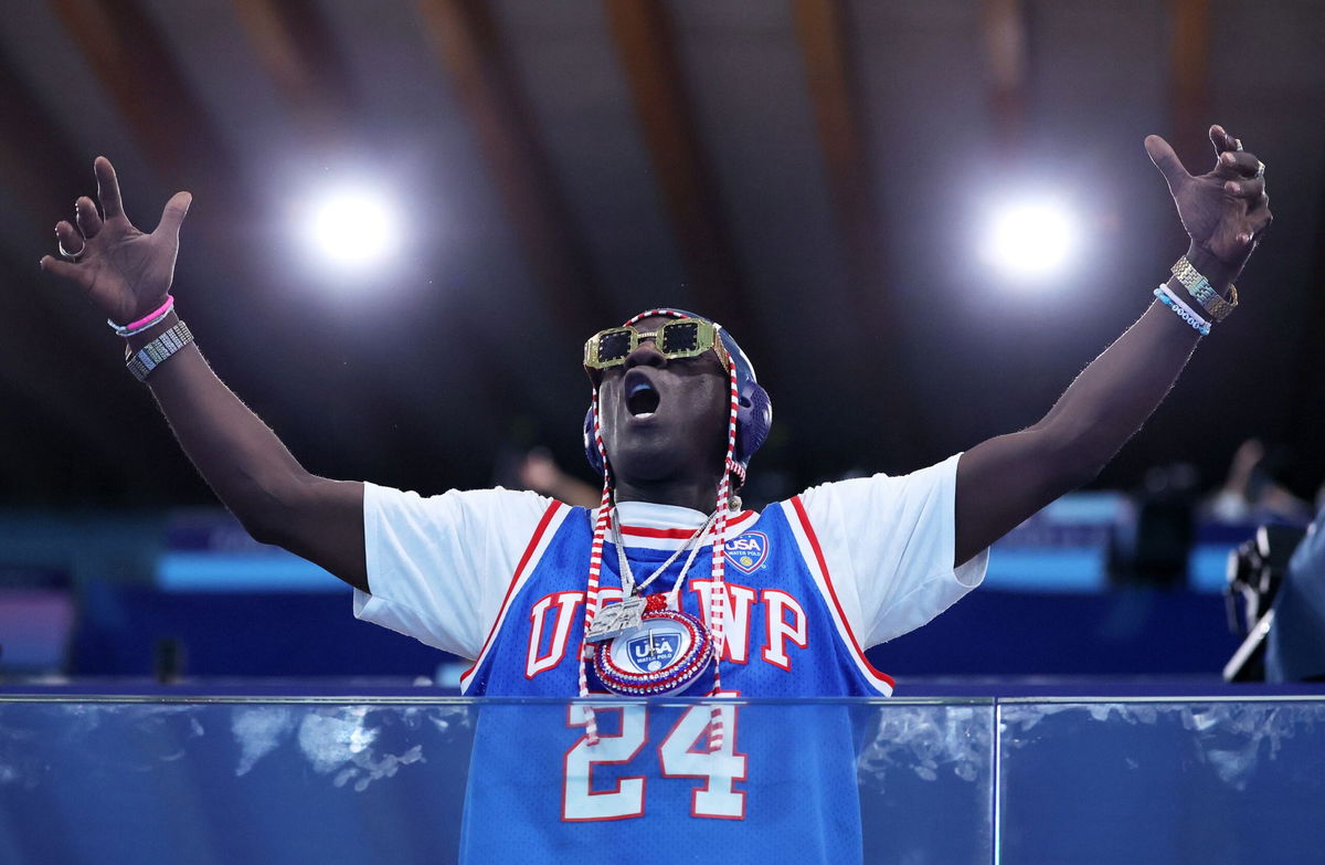 <i>Clive Rose/Getty Images via CNN Newsource</i><br/>American rapper Flavor Flav shows his support during the Women's Preliminary Round Group B match between Team Italy and Team United States on day five of the Olympic Games Paris 2024 at Aquatics Centre on July 31