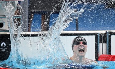 Katie Ledecky celebrates her victory in the women's 1500m swimming final at the 2024 Paris Olympic Games.