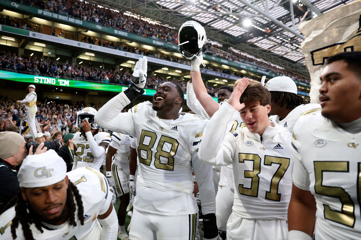 <i>Peter Morrison/AP via CNN Newsource</i><br/>Georgia Tech Yellow Jackets players celebrate after upsetting the No. 10 Florida State Seminoles at Aviva Stadium in Dublin