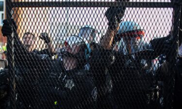 Chicago police secure fencing after a breach in the security barrier ahead of the Democratic National Convention on August 19