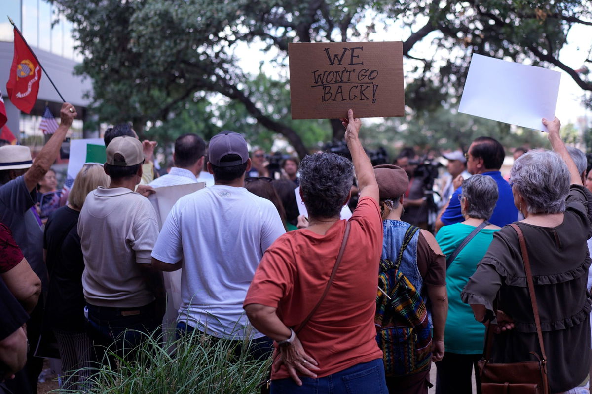 <i>Eric Gay/AP via CNN Newsource</i><br/>Supporters attend a news conference where officials with the League of United Latin American Citizens