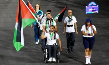 Fadi Aldeeb leads the Palestinian contingent during the Paralympic opening ceremony.