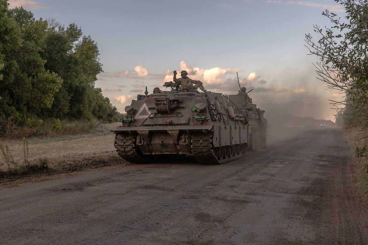 <i>Roman Pilipey/AFP/Getty Images via CNN Newsource</i><br/>Ukrainian servicemen operate an armored military vehicle in the Sumy region near the border with Russia on August 12.