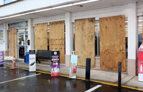 Store windows are boarded in Cedar Key in preparation for Hurricane Helene which is expected to make landfall as a Category 3 hurricane on September 26.