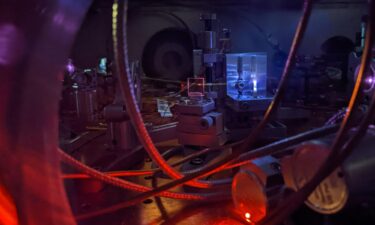 Scientists measure the frequency of energy pulses affecting an atom's nucleus by counting the waves in the UV signal. Wavelengths that can induce a nucleus transition oscillate at higher frequencies