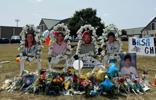 Images of the shooting victims are displayed at a memorial outside Apalachee High School on September 10 in Winder