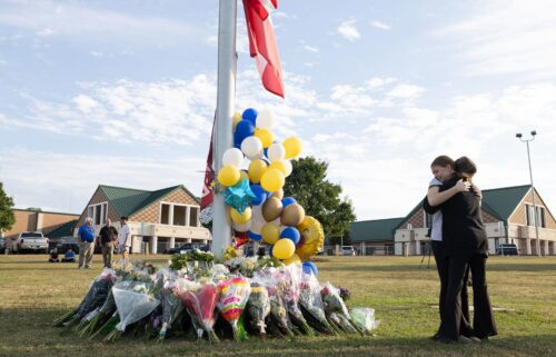 Students embrace near a makeshift memorial at Apalachee High School on September 5 in Winder