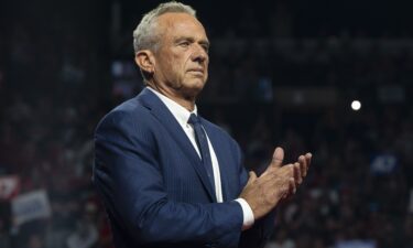 Robert F. Kennedy Jr. listens during a campaign rally for former President Donald Trump at the Desert Diamond Arena on August 23