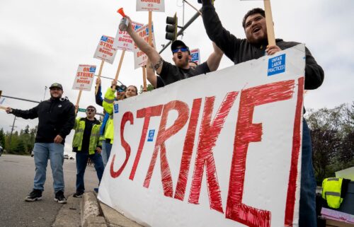 Workers with picket signs outside the Boeing Co. manufacturing facility during a strike in Everett