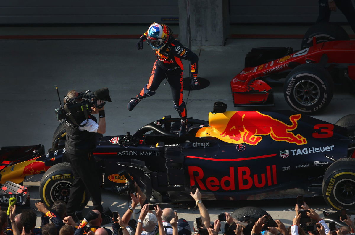 <i>Charles Coates/Getty Images via CNN Newsource</i><br/>Ricciardo celebrates winning the 2018 Chinese Grand Prix with Red Bull.