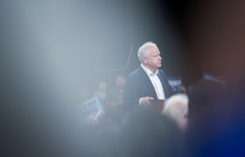 Attendees listen to Walz speak at a campaign rally in Erie