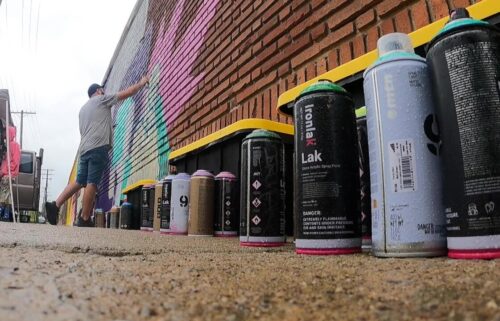 A brightly colored mural showcases the history and culture of Cleveland's Buckeye-Woodhill neighborhood.