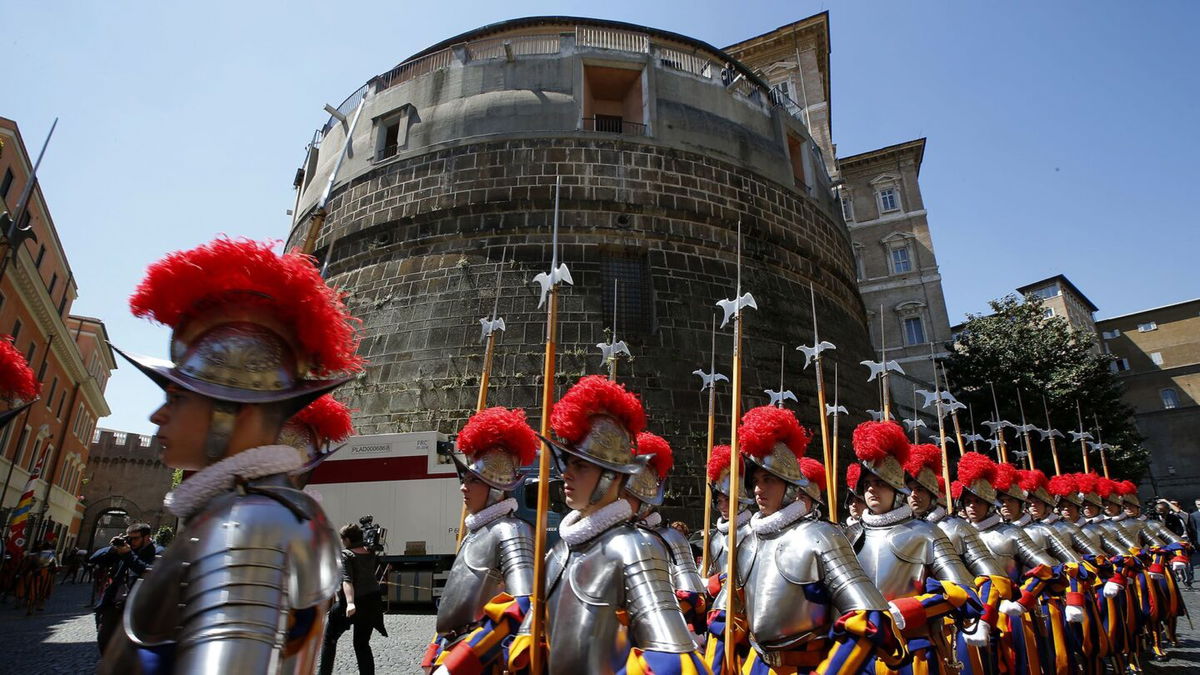 <i>Tony Gentile/Reuters via CNN Newsource</i><br/>Members of the Vatican's elite Swiss Guard march in front of the Institute for the Works of Religion (IOR).